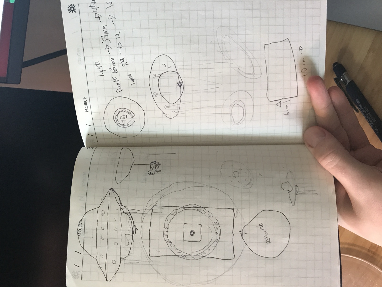 Notebook sketches working out saucer proportions and LED measurements