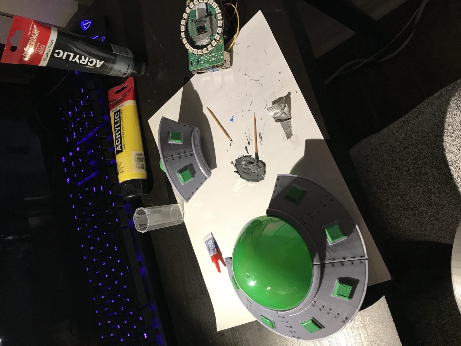 Painting session: acrylics, saucer parts, and the electronics standing by