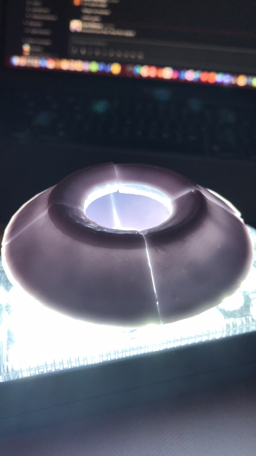 A resin test piece lit from below